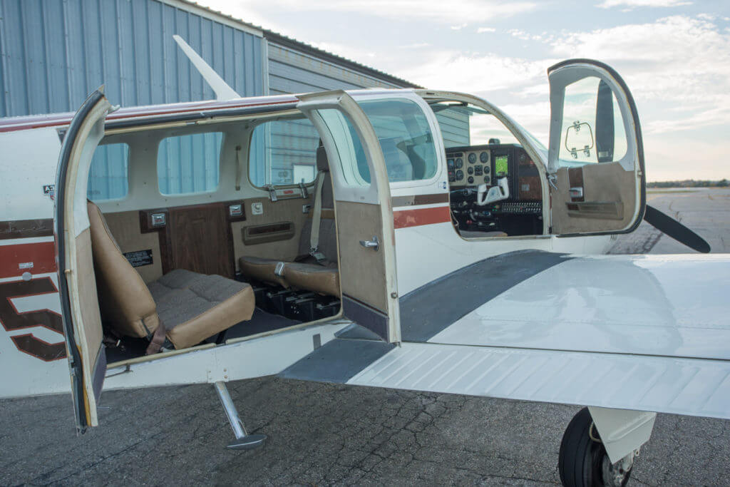 1976 Beechcraft Bonanza with doors open.