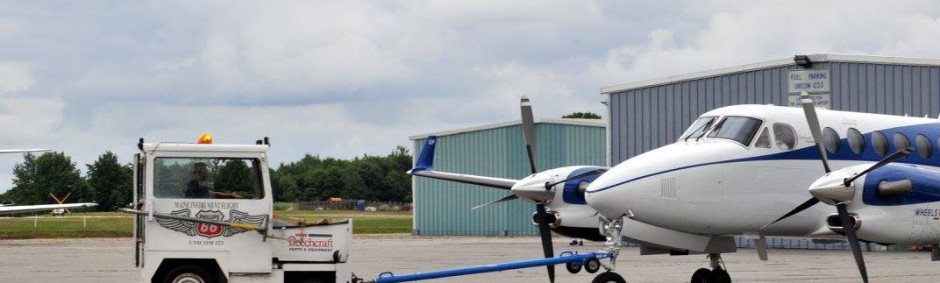 Banner for FBO Services at KAUG Augusta State Airport, Augusta, Maine.